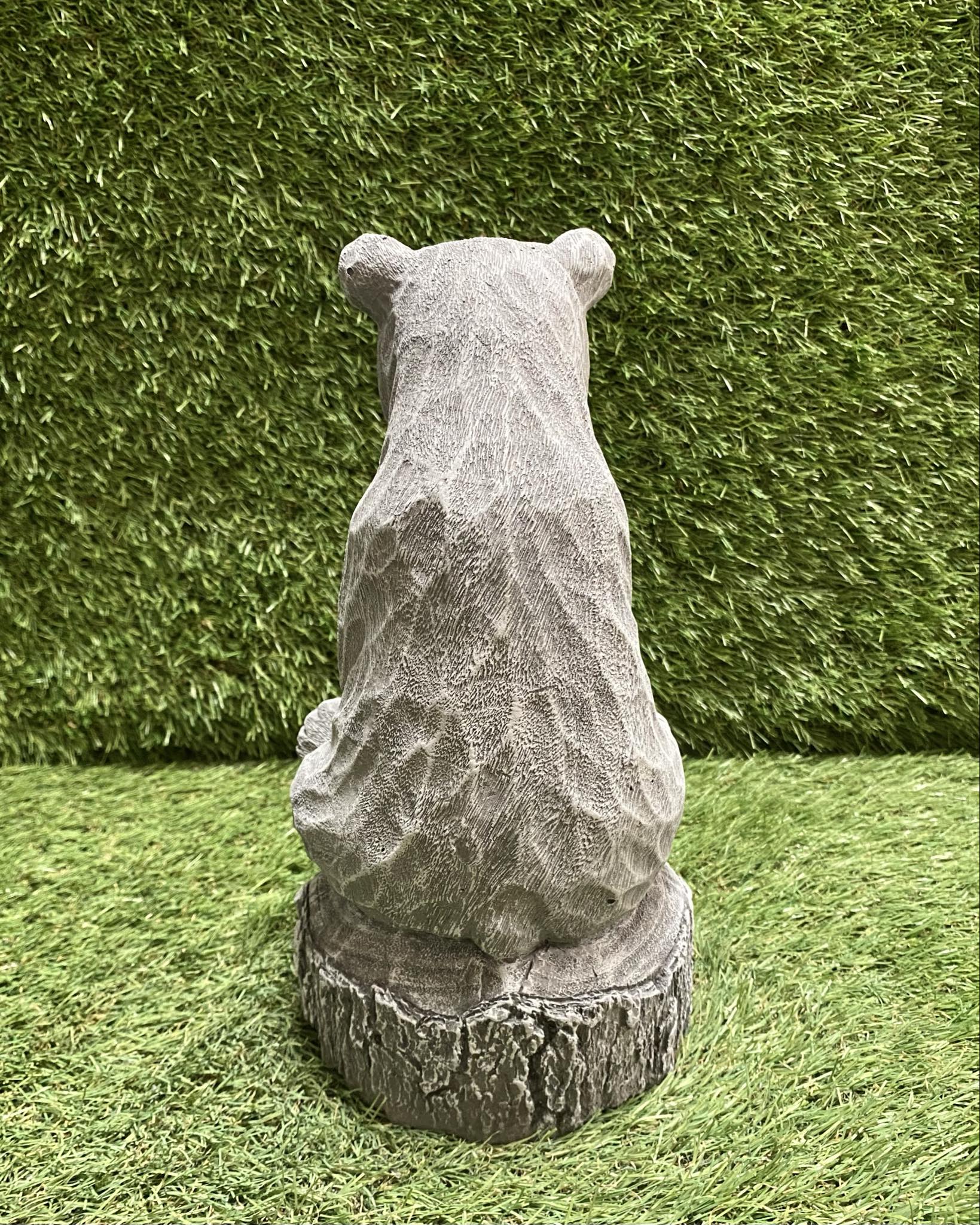 Bear Sitting On Stump