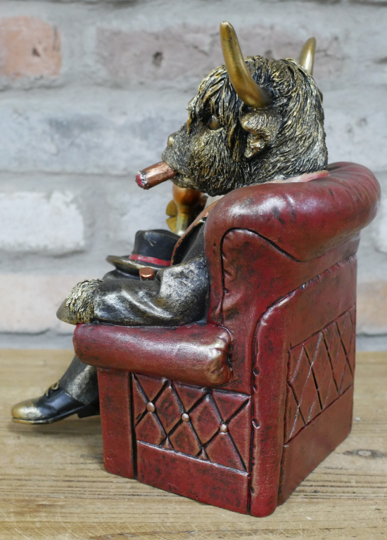 Gentleman Highland Cow Sat In A Chair