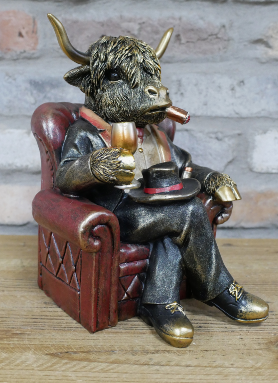 Gentleman Highland Cow Sat In A Chair