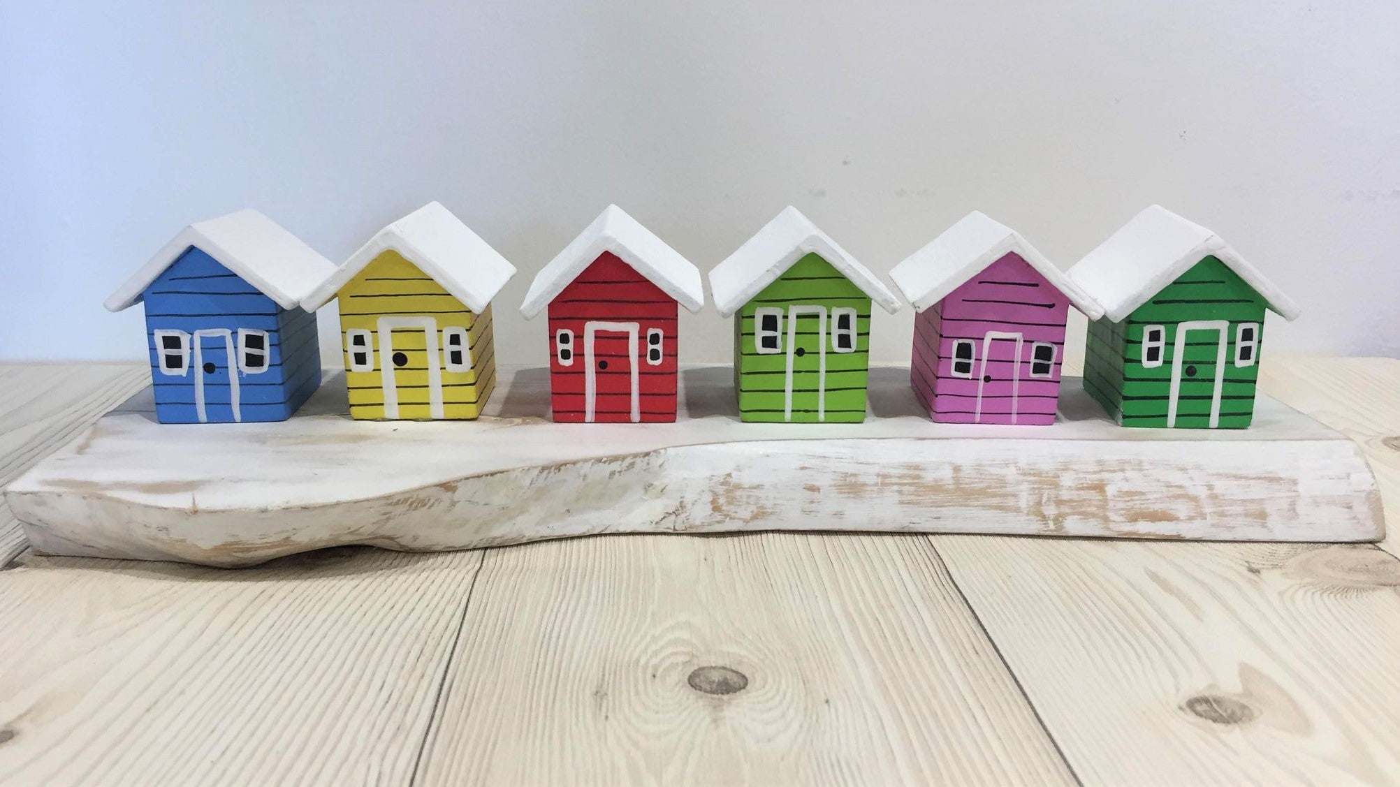 Coloured Beach Houses On A Block