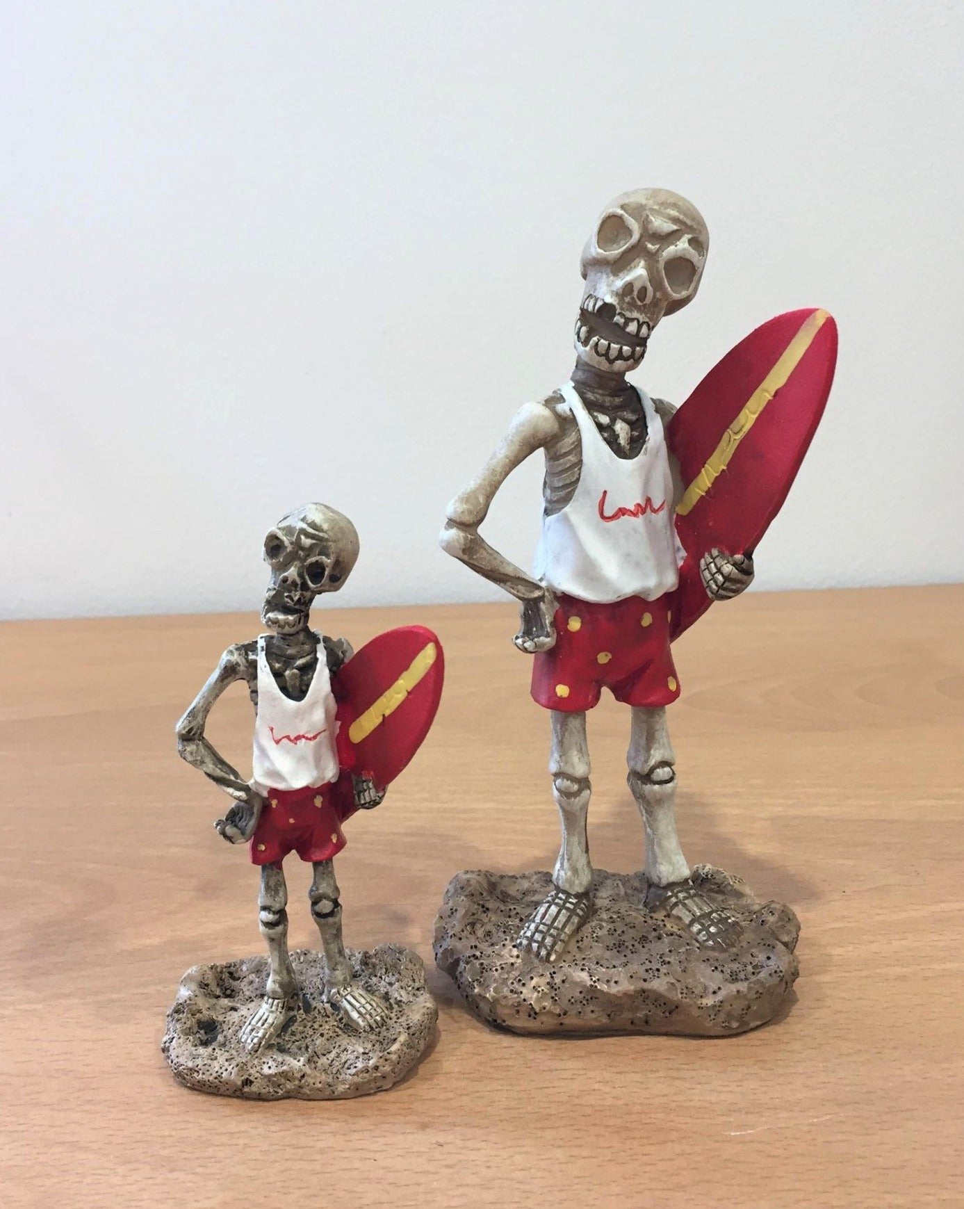 Skeleton Holding Surfboard
