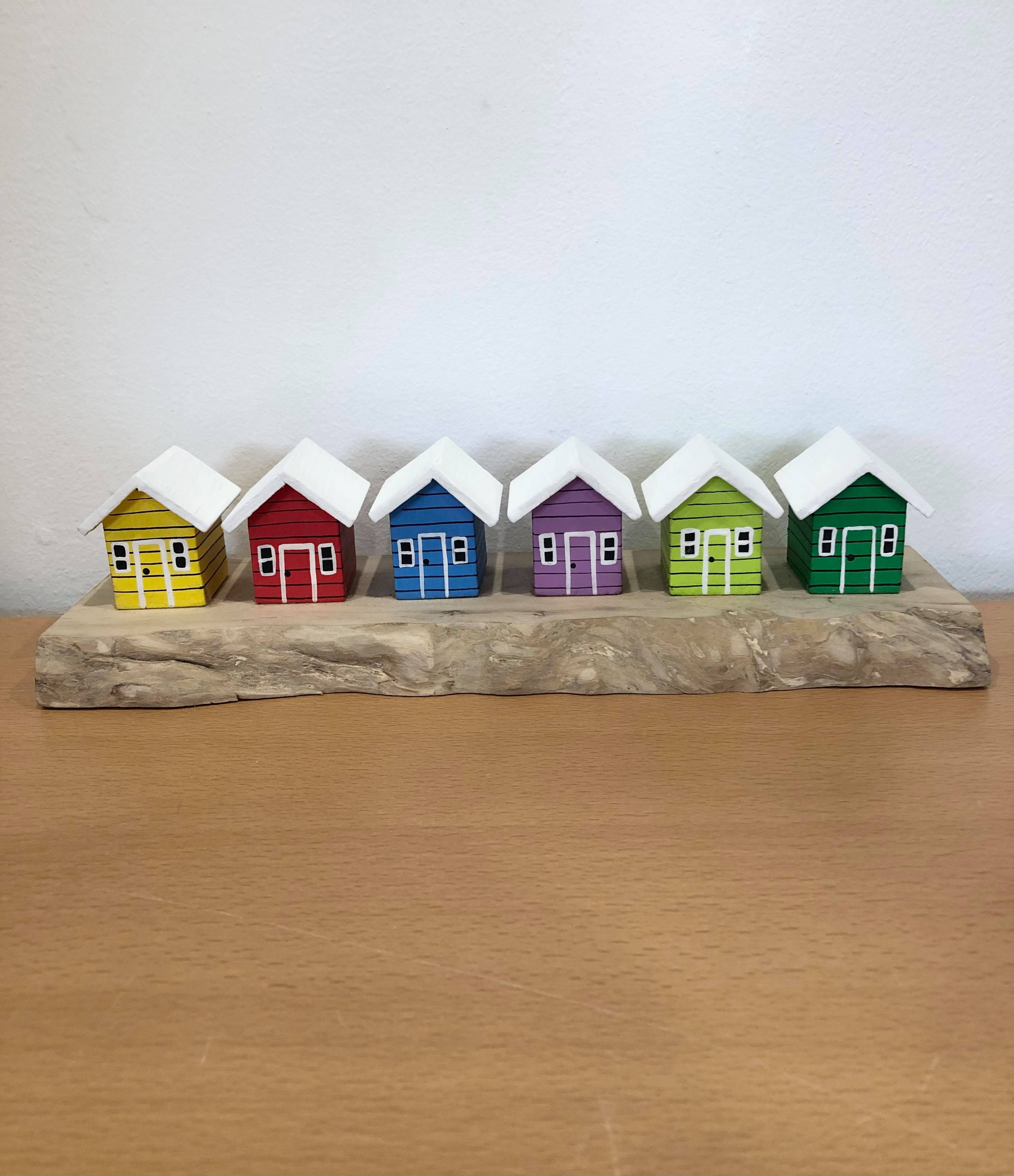 Coloured Beach Houses On Carved Light Brown Wood