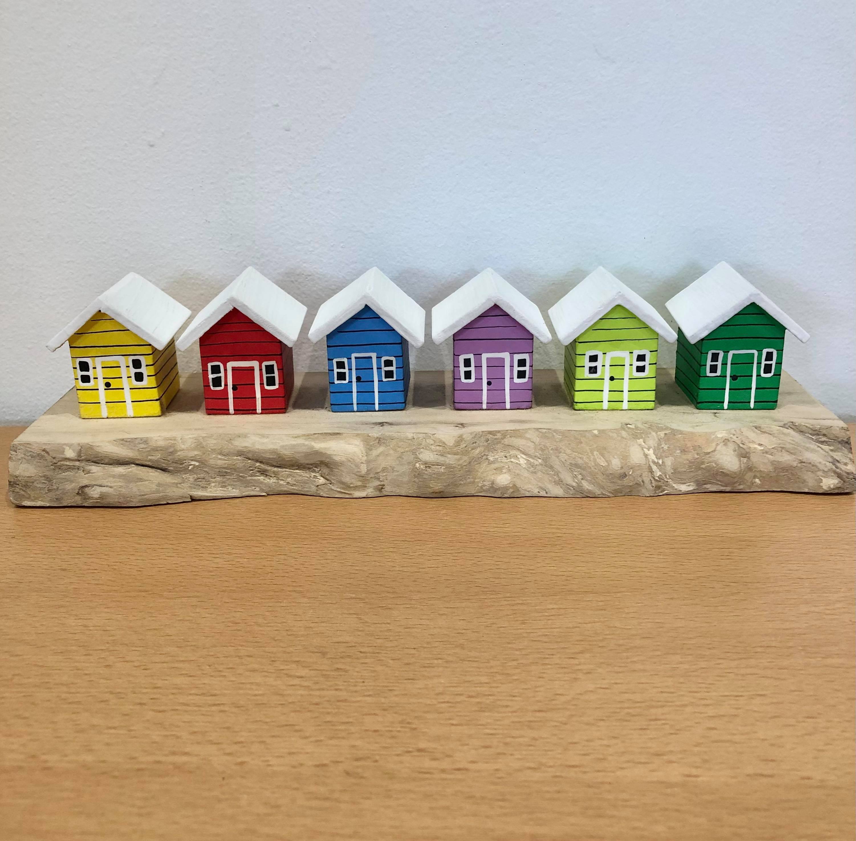 Coloured Beach Houses On Carved Light Brown Wood