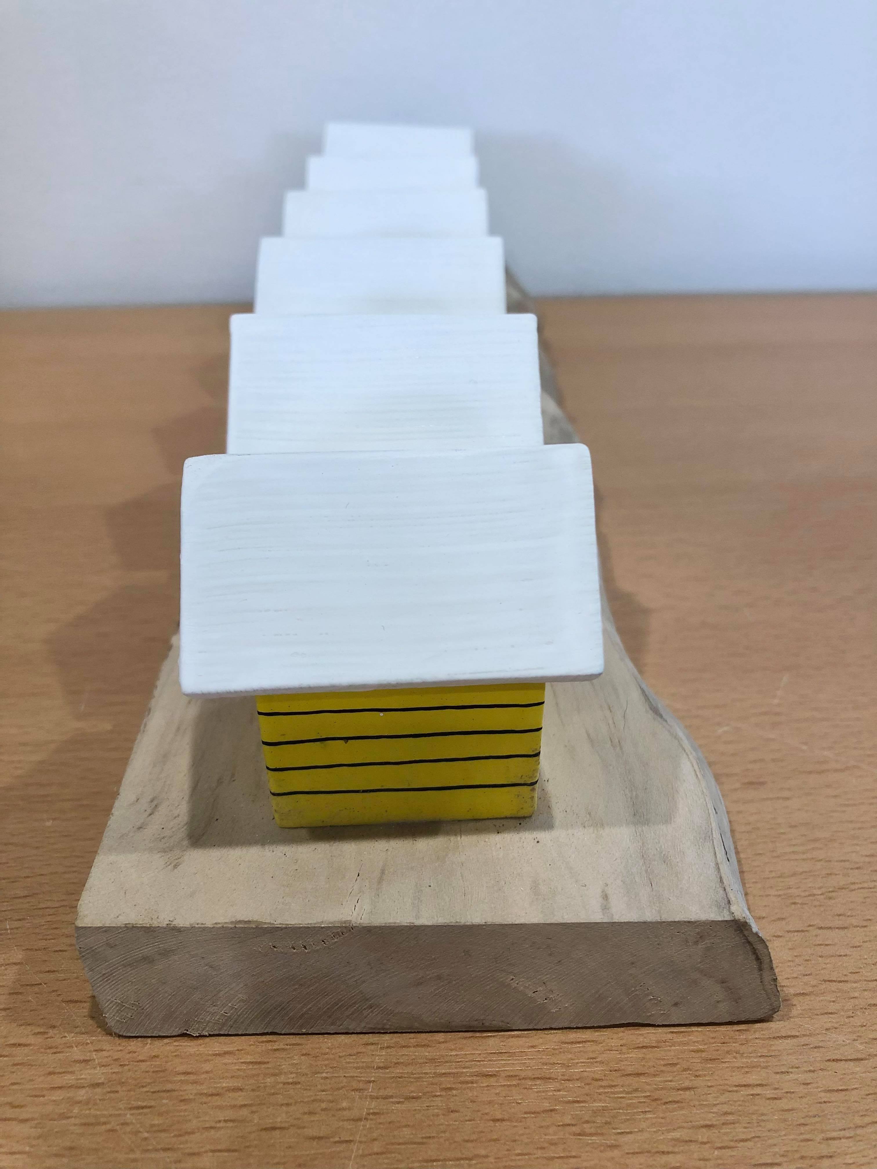 Coloured Beach Houses On Carved Light Brown Wood