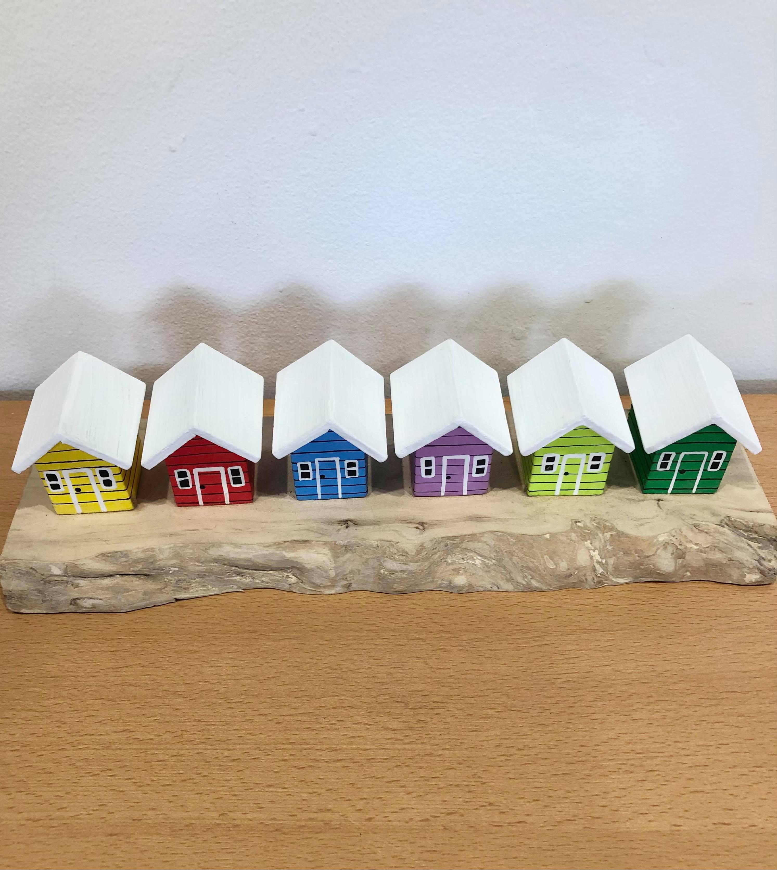Coloured Beach Houses On Carved Light Brown Wood