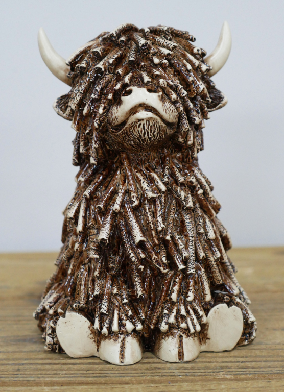 Small Sitting Highland Cow