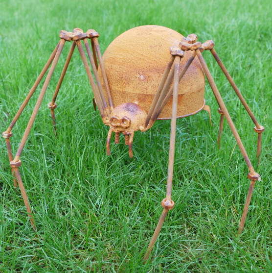 Decorative spider sculpture on grass