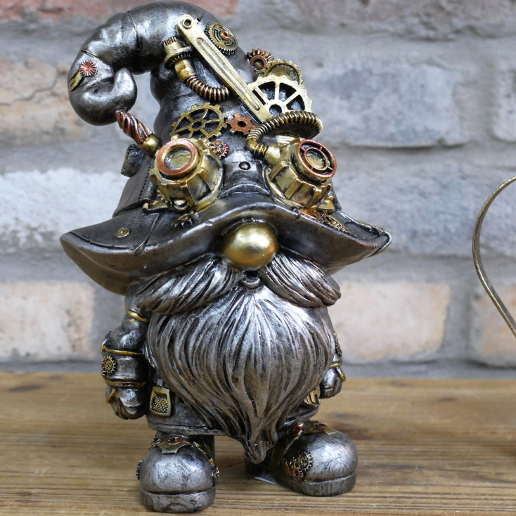 Steampunk-themed gnome figurine with intricate details on a wooden surface.