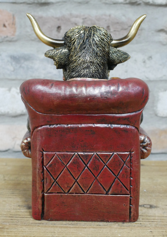 Gentleman Highland Cow Sat In A Chair