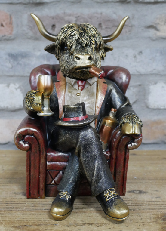 Gentleman Highland Cow Sat In A Chair